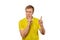 Funny male in yellow T-shirt asking to be quiet, silence gesture, white background