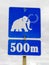 Funny mammoth symbol on road sign