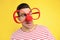 Funny man with clown nose and large glasses on background. April fool`s day