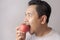 Funny Man Eating Red Apple