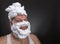 Funny man with shaving foam covered face