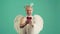 Funny man wearing angel costume white dress and feather wings. Giving heart. Valentine Day Gift concept.