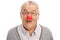 Funny mature man with a clown nose