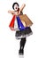 Funny mime in spotty dress holding shopping bags