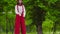 Funny mime walks on stilts and juggling in the park
