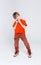 Funny mischievous boy in bright casual clothes at white studio background