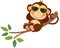 Funny monkey lying resting on the branch of the tree