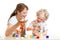 Funny mother and kid girl paint