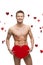 Funny naked man holding big red paper heart