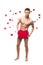 Funny naked man holding big red paper heart