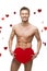 Funny naked man holding big red paper heart