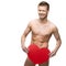 Funny naked man holding big red paper heart