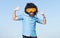 Funny nerdy guy in funny goggles pointing finger. Crazy funny bearded man with wig and fun glasses on sky background