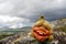 Funny Norwegian Troll figure laughing outdoors in dark and rainy landscape scenery