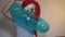 Funny office woman in Santa hat with inflatable ring
