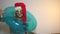 Funny office woman in Santa hat with inflatable ring