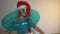 Funny office woman in Santa hat with inflatable ring