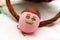 Funny painted smiling Easter egg lean on basket handle