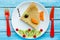Funny pancakes with fruits shaped fish for kids breakfast