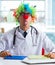 Funny pediatrician with clown wig in the hospital clinic