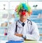 Funny pediatrician with clown wig in the hospital clinic