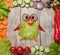 Funny penguin made of vegetables on table