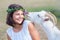 Funny picture a beautiful young girl farmer with a wreath on her