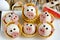 Funny pigs shaped snack tartlets stuffed with rice, surimi crab sticks, garlic and mayonnaise