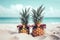 Funny pineapples with sunglasses on the sand beach against turquoise sea