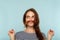 Funny playful carefree girl fooling hair mustache