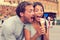 Funny playful young couple eating ice cream