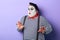 Funny plump mime in stiped clothes asking not to worry