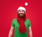 Funny portrait of bearded adult man in christmas elf clothes
