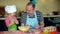 Funny portrait of cute little daughter with handsome father playing with flour