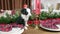 Funny portrait of cute smilling puppy sitting on the table in christmas decorated roo