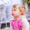 Funny portrait of little cute child girl having fun against water splash fountain holiday, rest, happiness, summer, childhood co