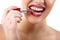 funny portrait of young beautiful woman with lipstick make grimace and show teeth