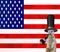 A funny posh meerkat wearing a top hat smoking the pipe and wearing a monocle glass, isolated on the american flag background, old