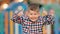 Funny positive little boy gesturing thumbs up on a colourful background