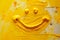 Funny positive smile face emoji made with yellow ink technique background.