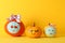 Funny pumpkins on yellow background