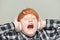 Funny red haired boy with headphones