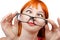 Funny red-haired girl in glasses