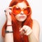 Funny redhair woman in big orange glasses