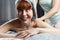 Funny redhead woman having a massage