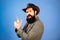 Funny retro bearded man in vintage dress. Finger gun gesture. Fun expression face.