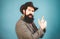 Funny retro bearded man in vintage dress. Finger gun gesture. Fun expression face.