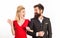 Funny retro couple. Blonde surprised woman in red dress looking at her bearded handsome future husband. Family photo of