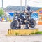 A funny robot on a motorcycle is made by the hands of car owners in Korolev
