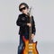 Funny rock child with guitar.fashionable little boy in sunglasses